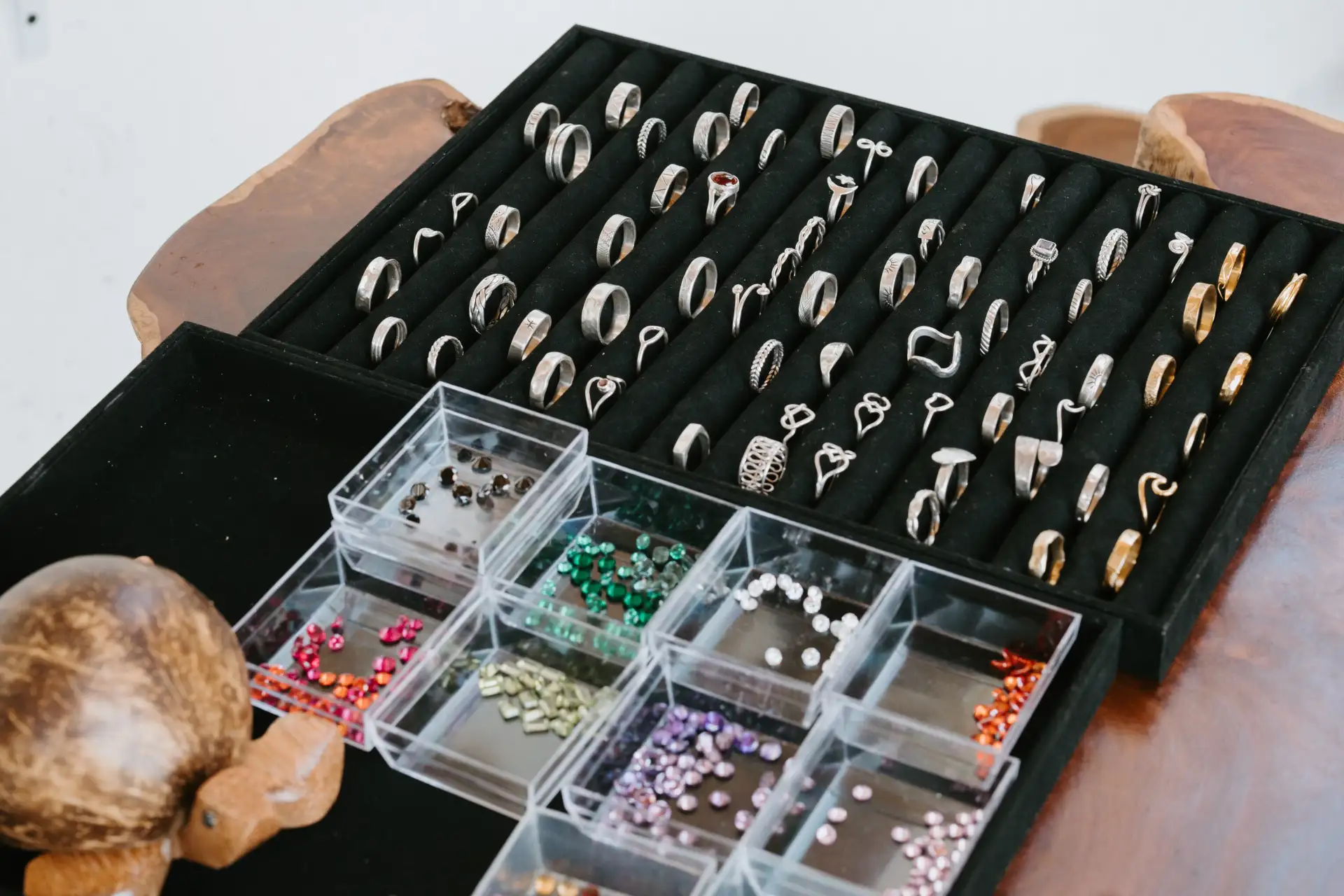 Handmade silver rings and gemstones displayed at Bali Turtle Jewelry Workshop